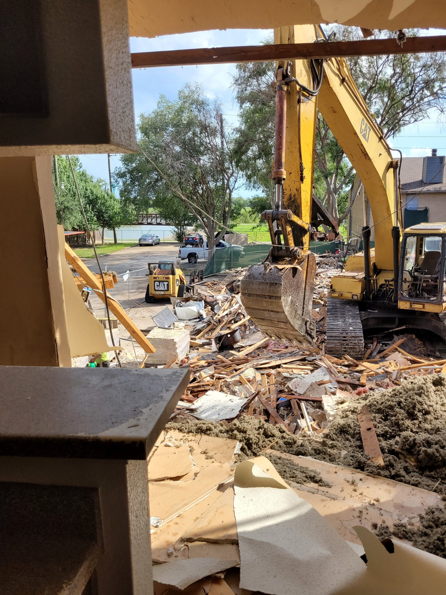 Commercial demolition project with heavy equipment on site